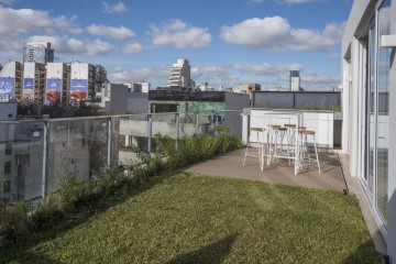 Área de co-working con terraza
